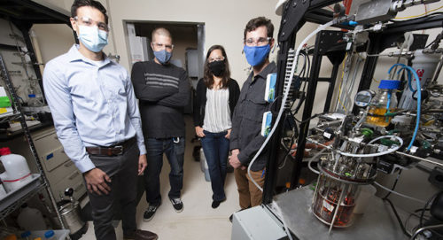 NREL scientists Eric Karp (left), Davinia Salvachua, Jeffery Linger, and Patrick Saboe have developed an energy-efficient and cost-effective process to produce butyric acid from biomass, which can be used as a precursor for renewable diesel and jet fuel. Courtesy: Dennis Schroeder, NREL