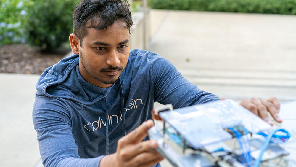 Santosh Ganji’s technology is able to take measurements within the wireless signal without any additional equipment. Image: Emily Oswald, Texas A&M Engineering