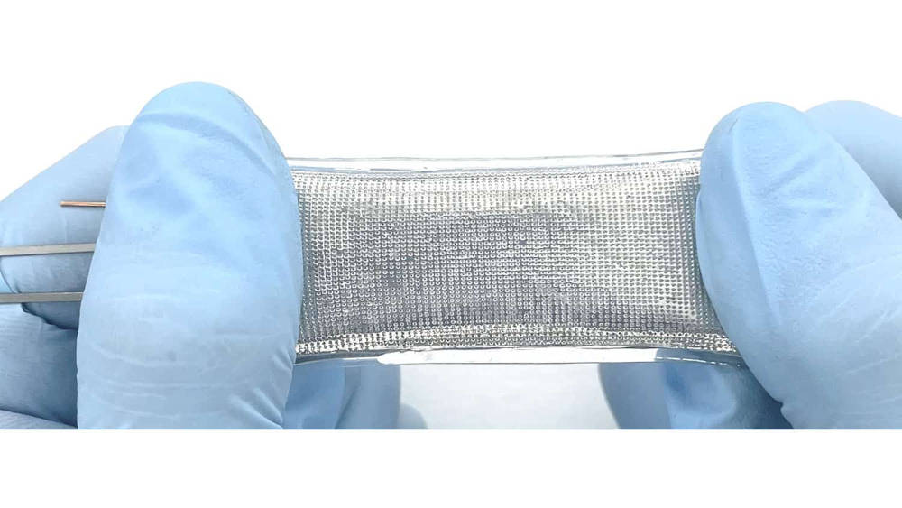 This image shows a container made of the new material that is elastic, flexible, and impervious to both gases and liquids. The material can be used to make ‘soft’ batteries for use with wearable electronics and other devices. Courtesy Michael Dickey, North Carolina State University